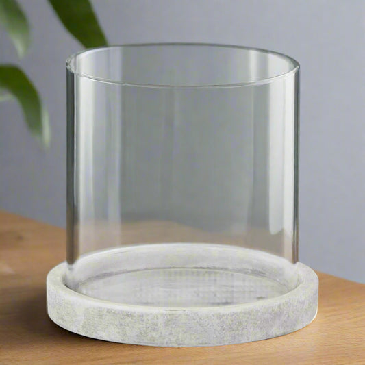 Front view of the 14cm hurricane lantern showing glass and stone-look finish on a wooden table.
