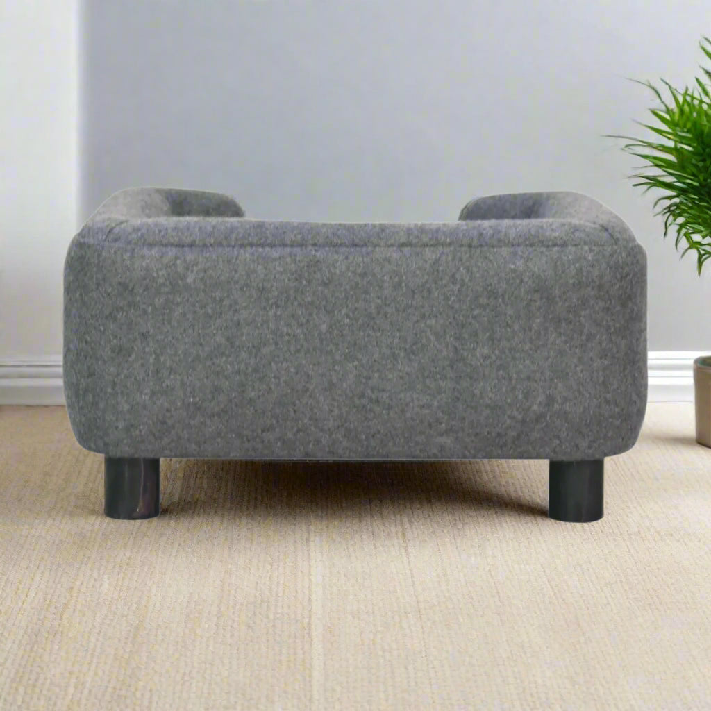 Rear view of the pet bed with natural wood frame and soft tweed backrest.