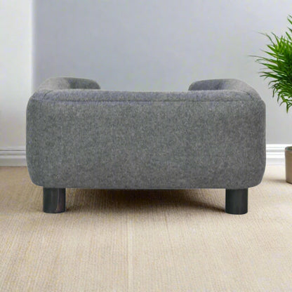 Rear view of the pet bed with natural wood frame and soft tweed backrest.