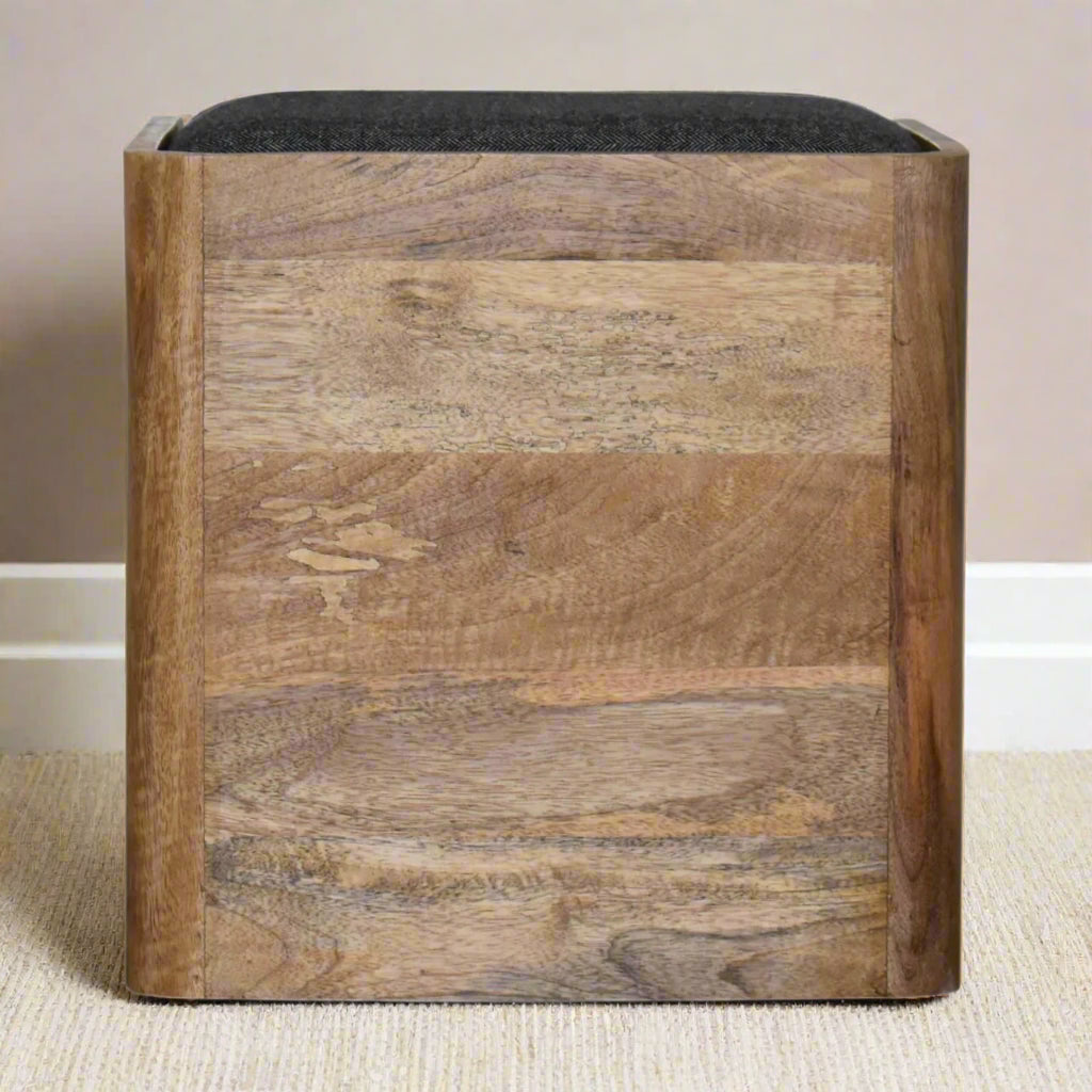 Back view of the pet bed showing the smooth wood grain finish, and soft black cushion.