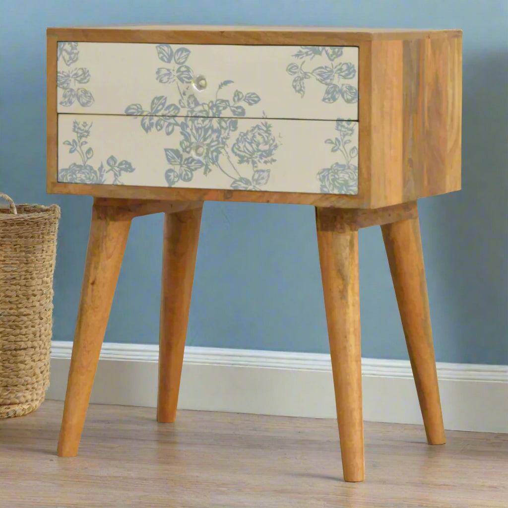 Blue Floral Screen Print 2 Drawer Bedside Table in oak-ish finish, front right angled view, with blue floral drawers and glass knobs.


