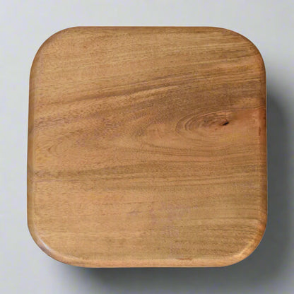 Aerial shot of the underside of one blue and white square bowl, displaying its solid mango wood construction.