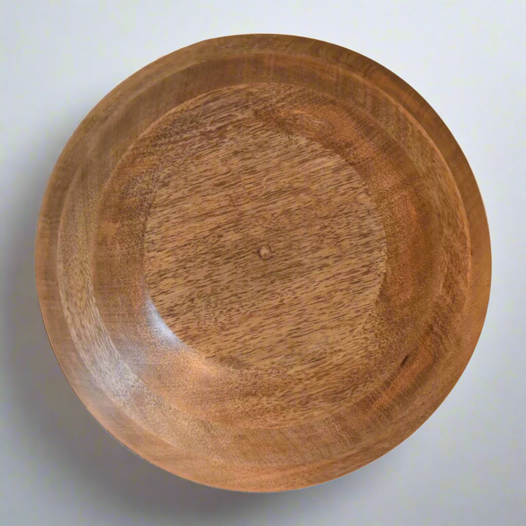 Upside‑down bowl showing smooth wooden base and natural grain