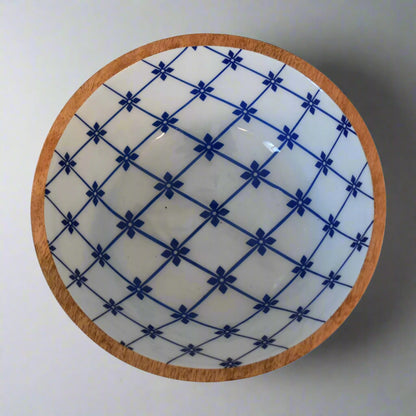 Close aerial of one bowl showcasing detailed floral lacquer