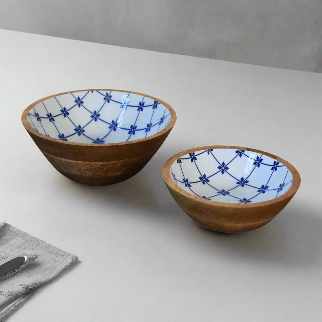 Top‑angled view of two bowls on white countertop showing floral pattern
