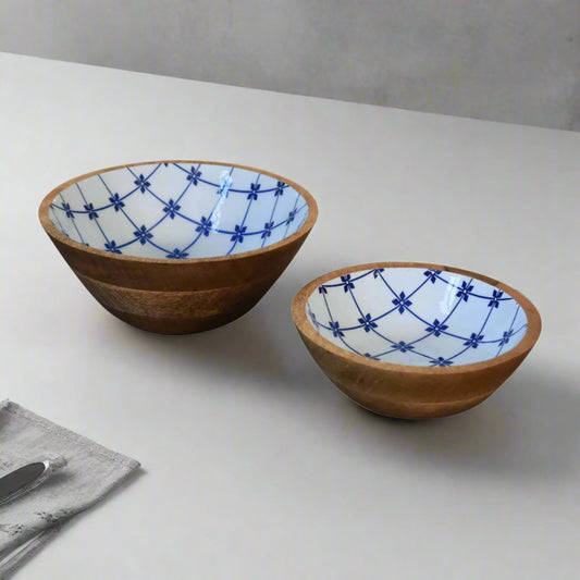 Top‑angled view of two bowls on white countertop showing floral pattern

