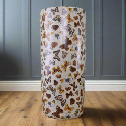Full front view of ceramic butterfly umbrella stick stand with distressed finish, displayed indoors – Purple Flamingo UK
