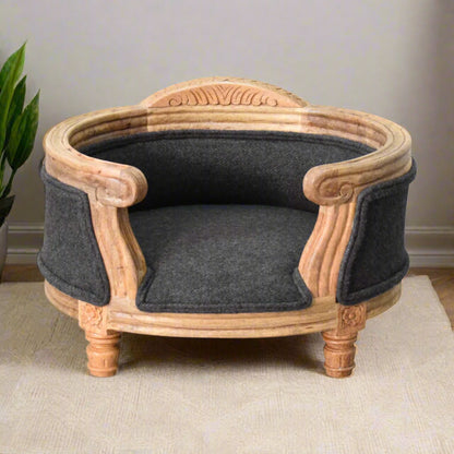 Luxurious carved pet bed made from natural wood with padded battleship tweed cushions, styled like a mini armchair for cats or small dogs.
