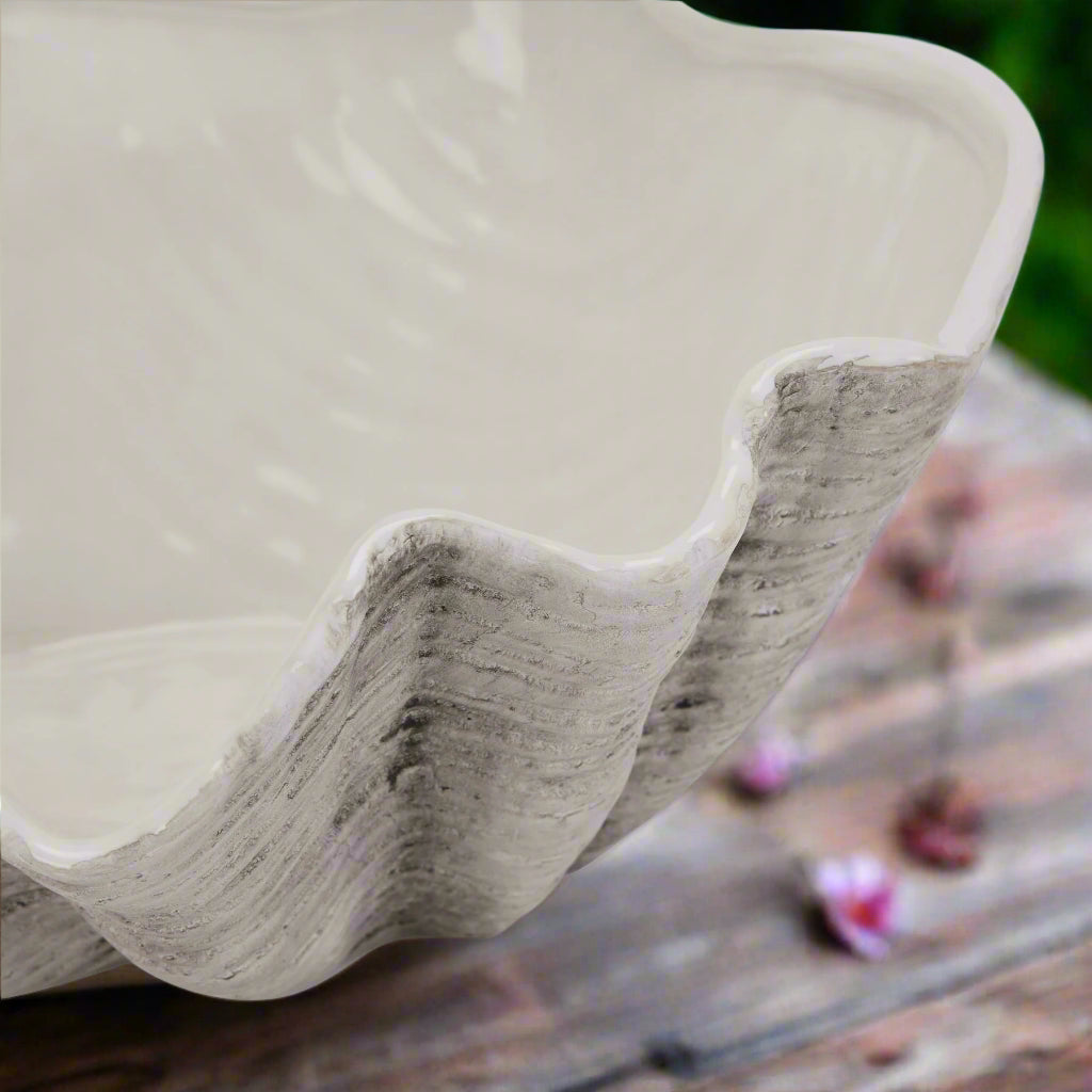 Close-up view focusing on the curves and contours of the large 40cm ceramic Adele Shell bowl, showing its classic finish and edge.