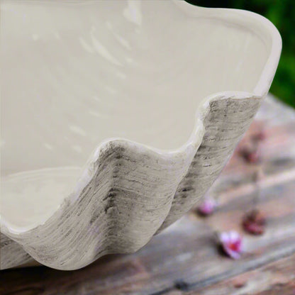 Close-up view focusing on the curves and contours of the large 40cm ceramic Adele Shell bowl, showing its classic finish and edge.