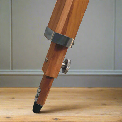 Closer look at the capped leg of the tripod stand of the Chrome Caged Spotlight Floor Lamp.