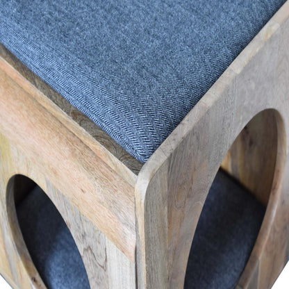 Detailed close-up of the black tweed seat pad and corner craftsmanship, highlighting the refined joinery of the wooden pet furniture.