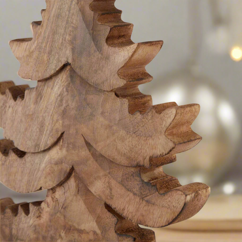 close up view of free standing wooden tree decoration, highlighting the intricately carved branches. Shop at Purple Flamingo UK