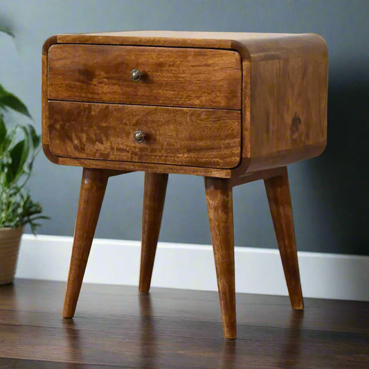 Angled front view of the curved chestnut bedside table, showing its smooth rounded edges and two practical storage drawers.