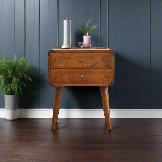 An elegant curved 2-drawer bedside table in a rich chestnut finish, made from solid mango wood with Nordic-style legs, perfect for any bedroom.
