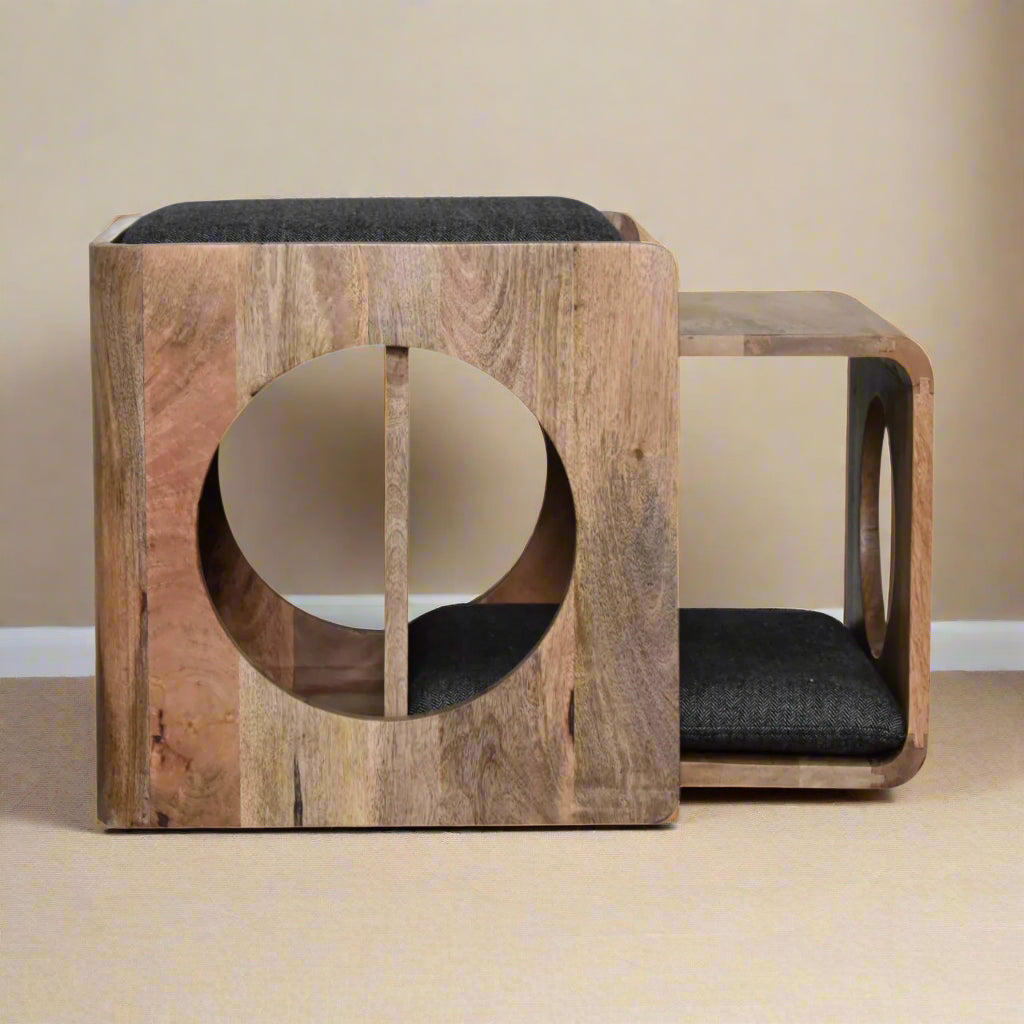 A side view of the multi-functional pet bed with the pet bed partly detached from the seat, showing dual entry points and plush interior pad for cats or small dogs.