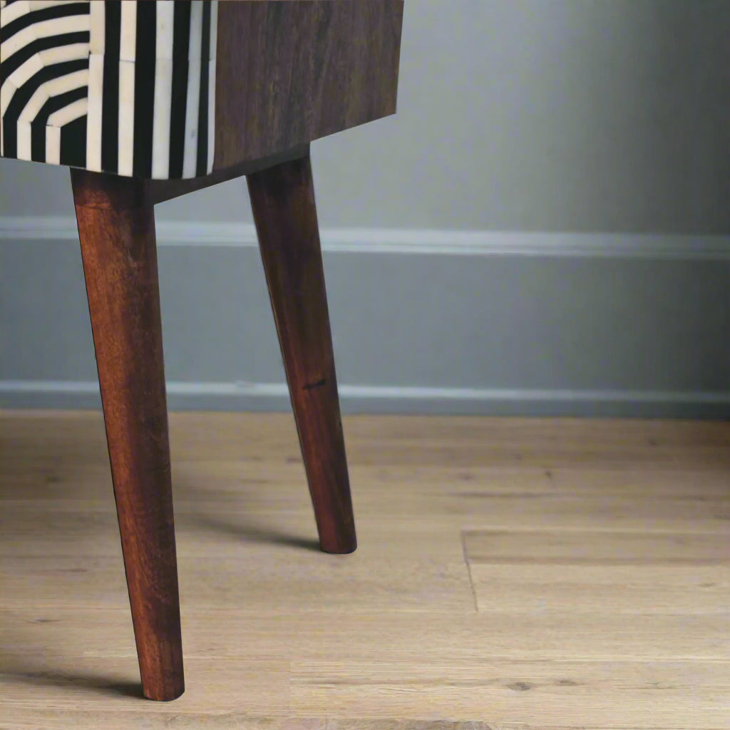 Lower left side view of the Edessa Bone Inlay 2 Drawer Bedside Table, specifically highlighting its full Nordic style legs.