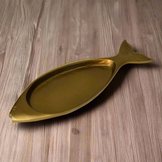 Full view of the fish-shaped brass tray with raised surface – a decorative home accent.