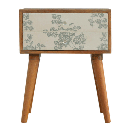 A rotating GIF showing the Green Floral Screen Printed 2 Drawer Bedside Table from multiple angles, highlighting its design, drawers, and legs.