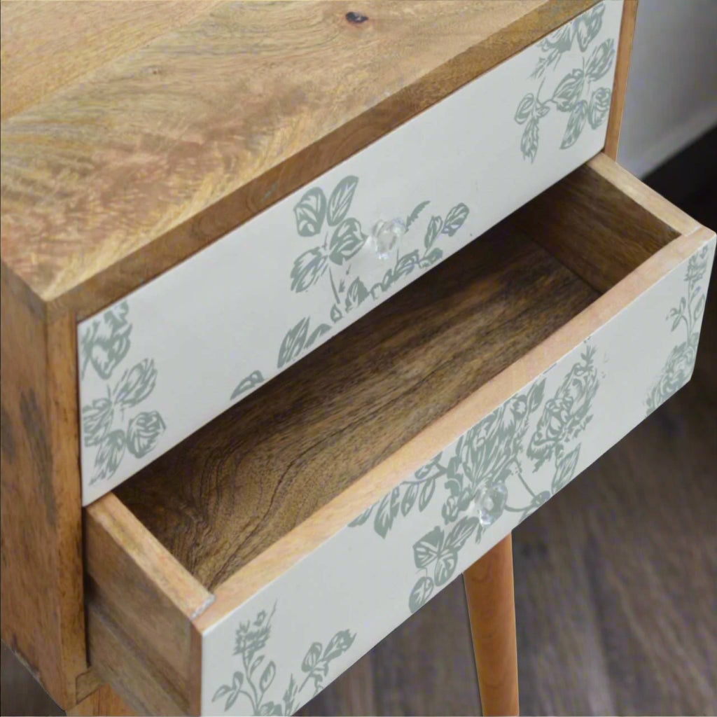 Top-down view of the Green Floral Screen Printed 2 Drawer Bedside Table, specifically with the lower drawer drawn out to show its storage capacity.