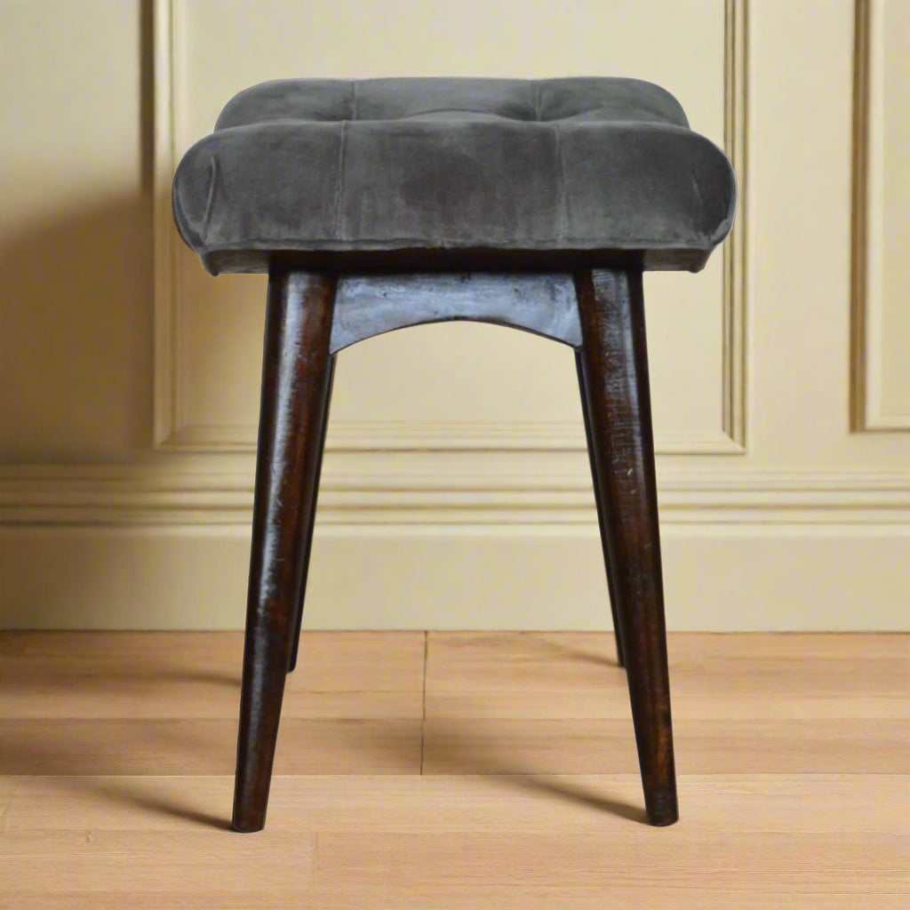 Side view of the grey velvet curve stool, illustrating its curved shape and overall dimensions.