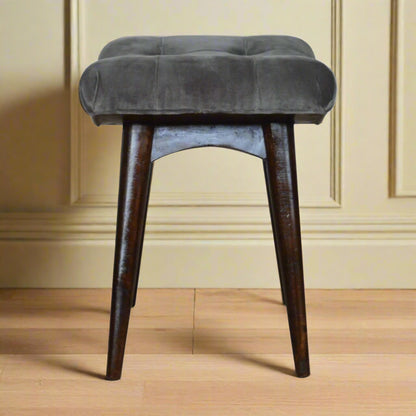 Side view of the grey velvet curve stool, illustrating its curved shape and overall dimensions.