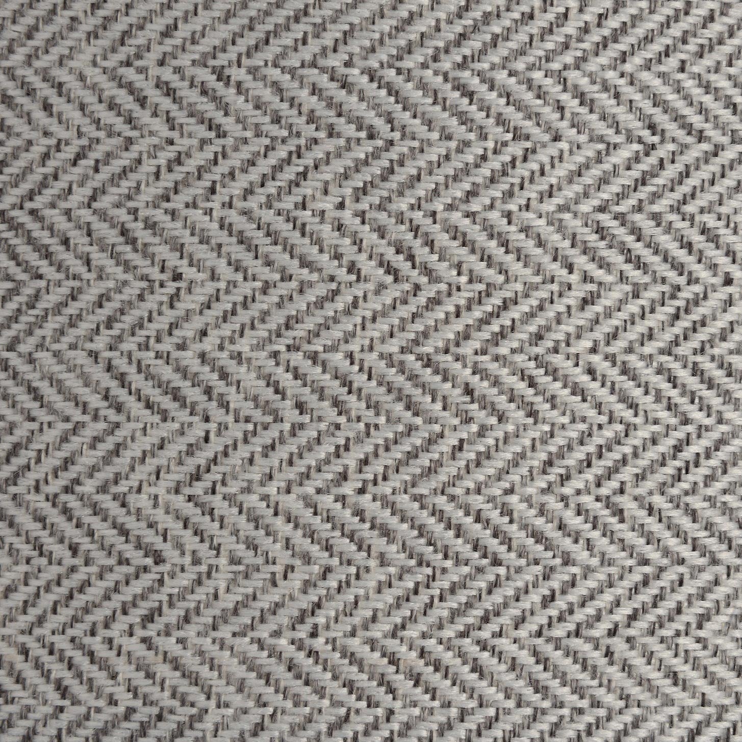 Detailed shot of the grey and white herringbone fabric lampshade, highlighting its refined woven texture and neutral tones.