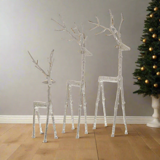 Three differently sized majestic stags sculpted beautfully in metal, grouped together in an eye-catching display. Multi-buy discount available at Purple Flamingo UK.