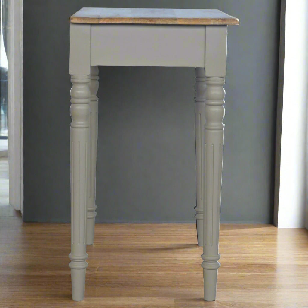 Side view of the Hand Painted Desk, showcasing its slim profile and the elegant design of its legs.