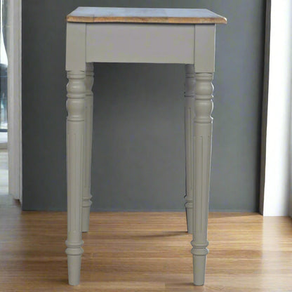 Side view of the Hand Painted Desk, showcasing its slim profile and the elegant design of its legs.