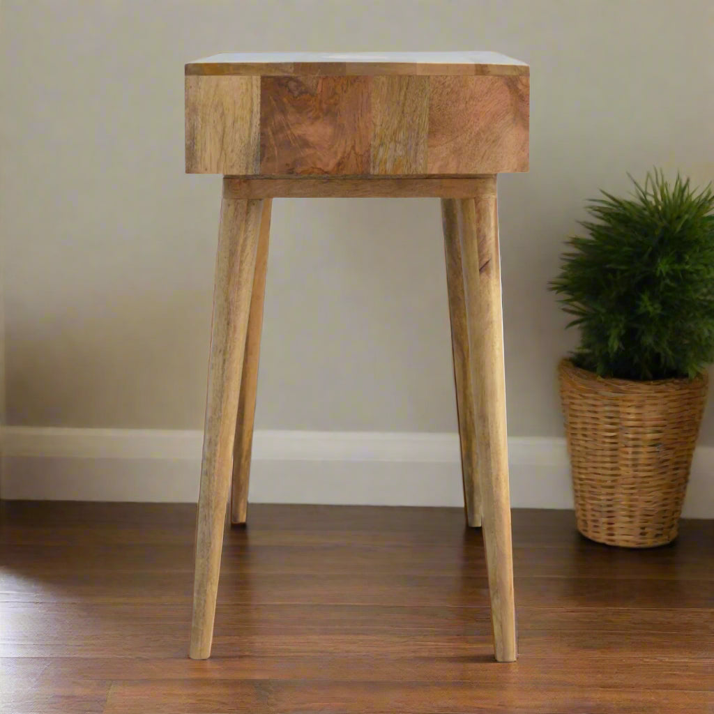 Side view of the Honeycomb Bone Inlay Desk, complemented by an inhouse plant in the background, showcasing its depth.