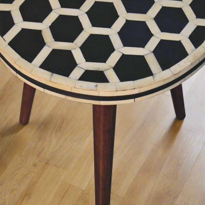 Aerial view of the Honeycomb Bone Inlay Tripod End Table, showcasing the intricate honeycomb bone inlay pattern on its top and one leg.