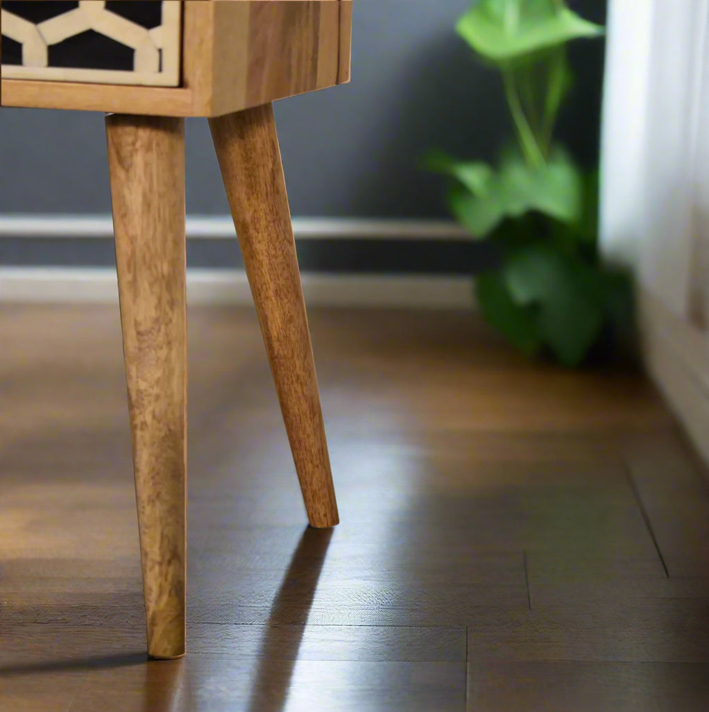 Close-up view of the Nordic style legs of the Honeycomb Mini Bone Inlay 1 Drawer Bedside Table, highlighting their tapered design.