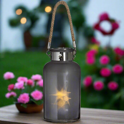 Same outdoor lantern setup, now lit up to show the warm ambient LED effect.
