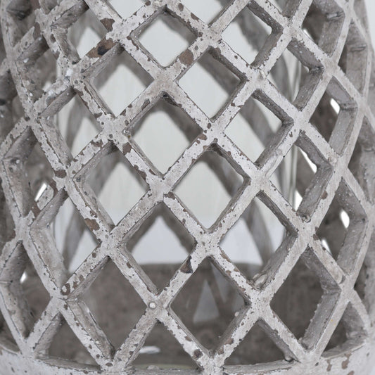 Close-up of the ceramic lantern's lattice pattern showing the natural stone finish.