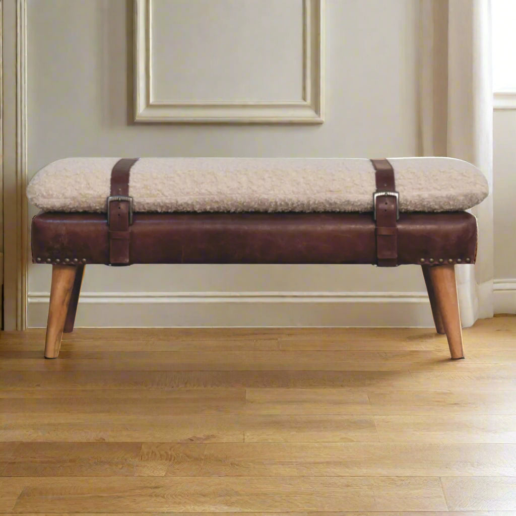 Full front view of the brown Leather Bouclé X Bench with strap detail and wooden legs