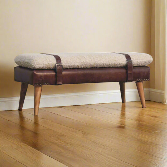 Bench in a room setting, angled to show luxurious texture and slim silhouette