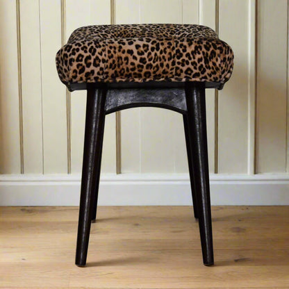Side view of the Leopard Print Curve Stool, illustrating its curved silhouette and overall dimensions.
