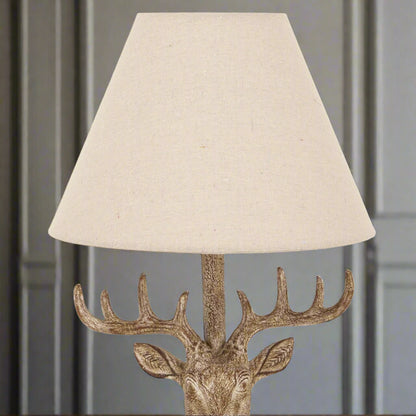 Detail of linen shade and top section of stag head table lamp, highlighting refined rustic style from Purple Flamingo UK.