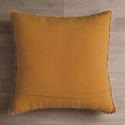 Rear panel of mustard yellow Lira cushion showing smooth underside and stitching details – Purple Flamingo UK