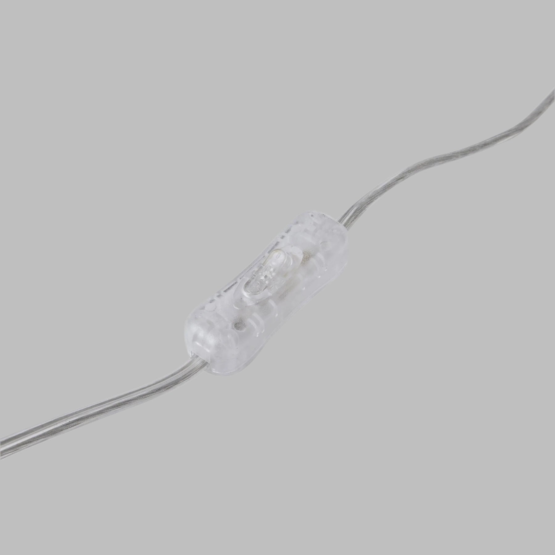 Top-down view of the lamp switch on the Malabar blue ceramic lamp.