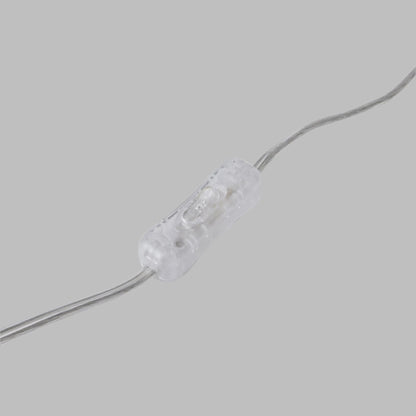 Top-down view of the lamp switch on the Malabar blue ceramic lamp.
