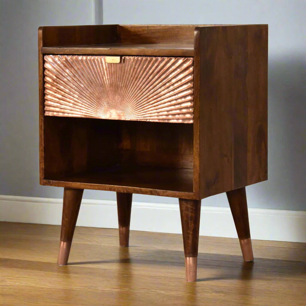 Angled view of the Manila Copper 1 Drawer Bedside Table, showing its left side, front, and all four Nordic style brass-capped feet.