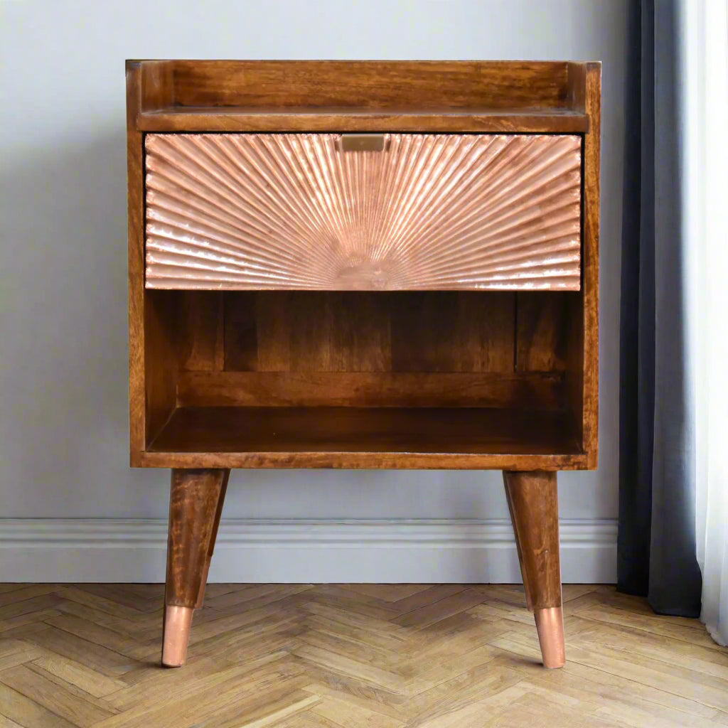Front view of the Manila Copper 1 Drawer Bedside Table, showcasing its distinctive copper plated drawer, open slot, and Nordic style feet with elegant brass caps.
