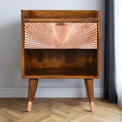 Front view of the Manila Copper 1 Drawer Bedside Table, showcasing its distinctive copper plated drawer, open slot, and Nordic style feet with elegant brass caps.