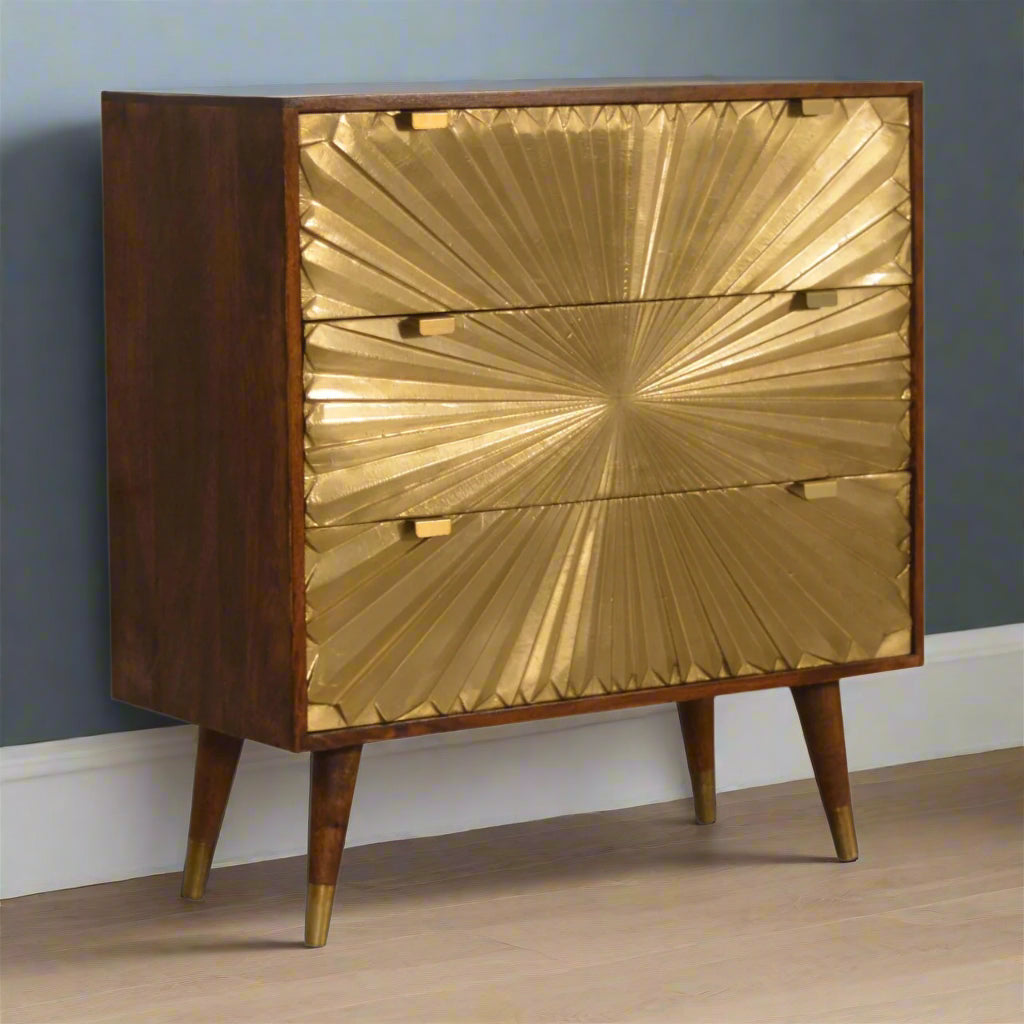 Angled front view displaying three brass sunrise drawers and Nordic legs
