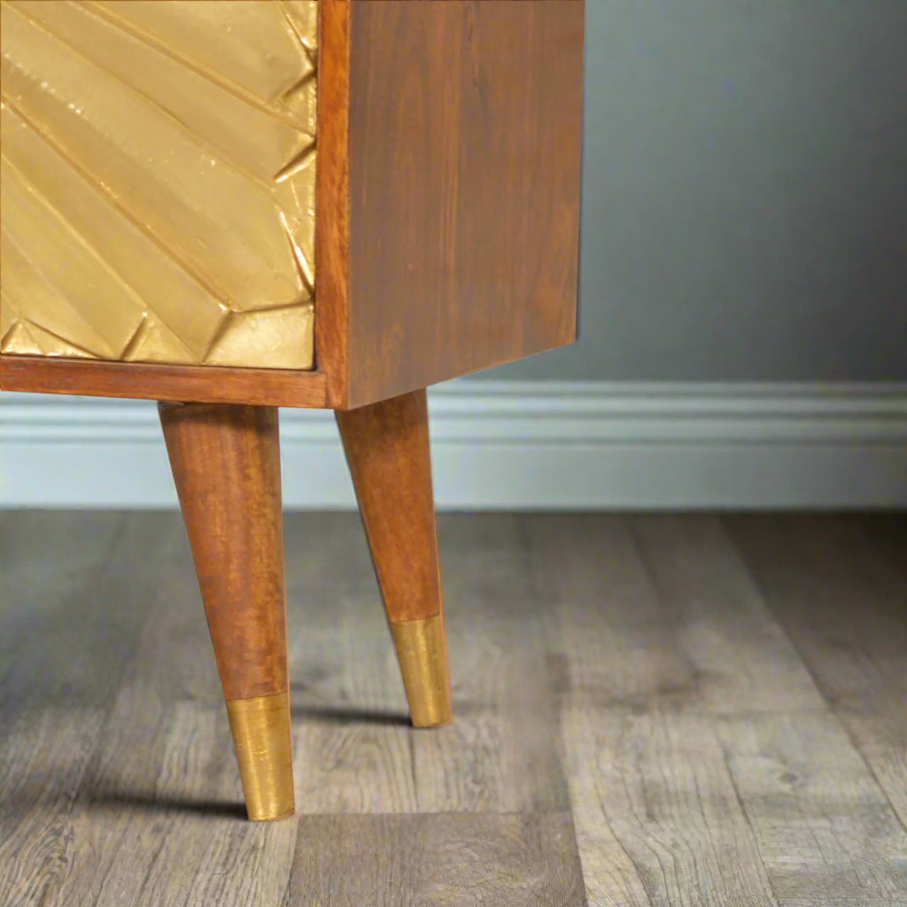 Detail of bottom left brass‑cap leg and lower drawer
