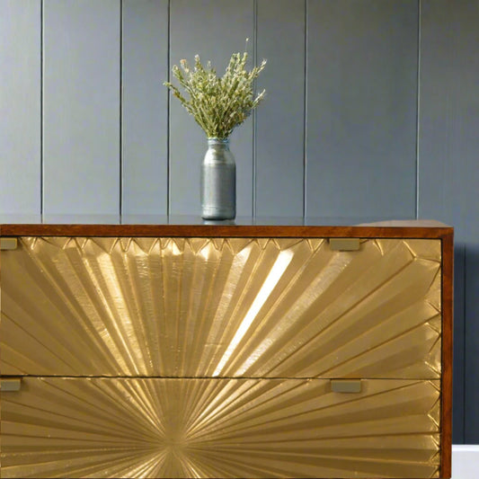 Close‑up of top left corner with decorative plant on chestnut surface
