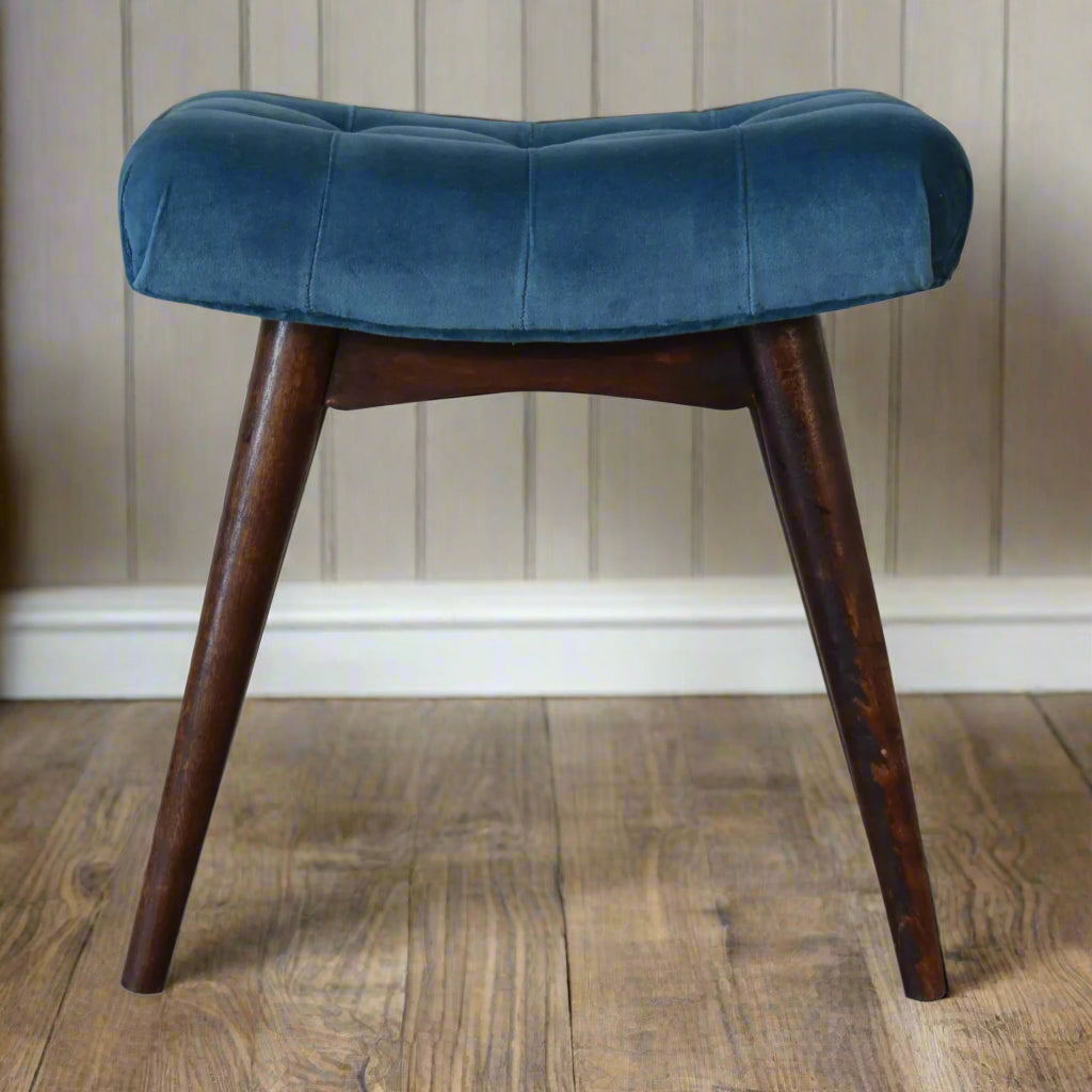 Front view of the mini teal velvet curve bench, showcasing its soft teal upholstery and the front feet with a walnut finish.