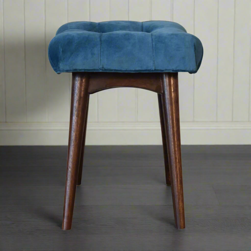Full side view of the mini teal velvet curve bench, showing its curved design and walnut finish legs.